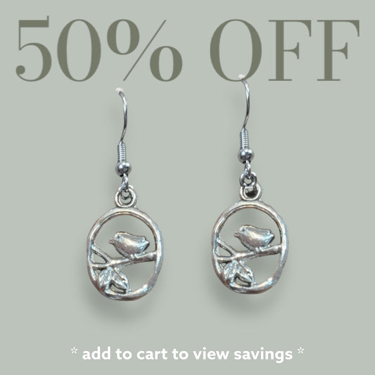 Oval Charm With Bird Perched on Branch Dangle Earrings