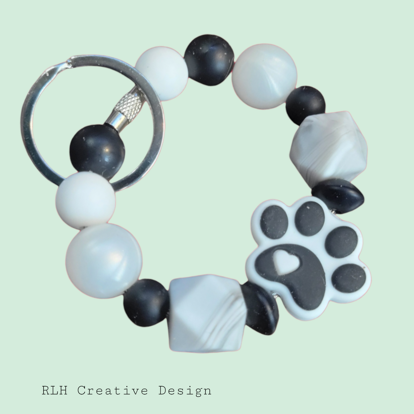 White and Black Paw Print Small Loop Silicone Beaded Keychain by RLH Creative Design