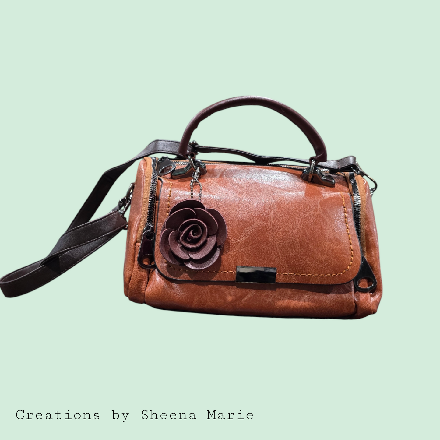 Faux Leather Barrel Crossbody Bag with Rosette Keychain